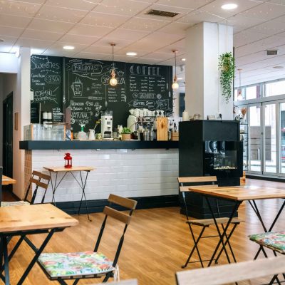 Empty modern cafe interior with chairs and tables