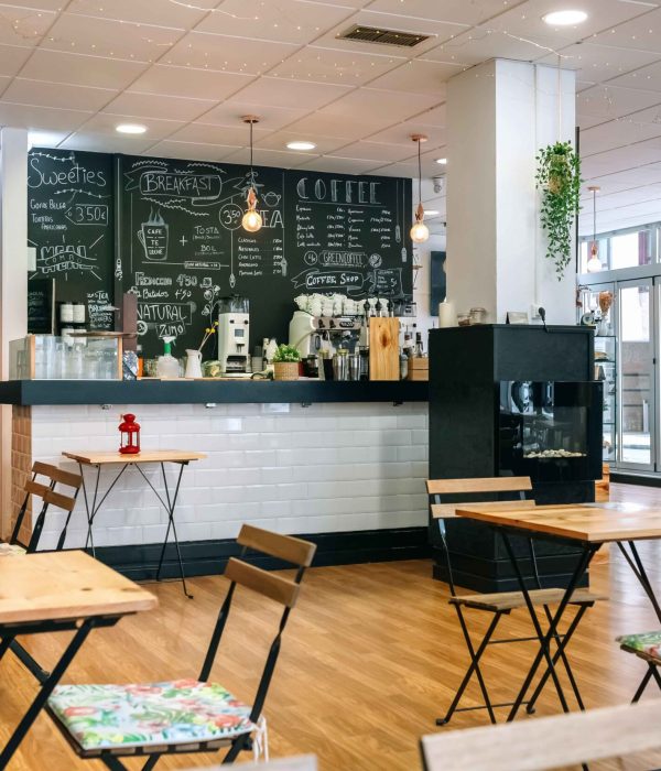 Empty modern cafe interior with chairs and tables